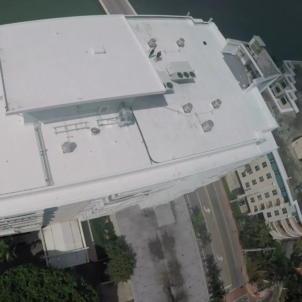 Three photographs from Perkins Roofing’s Fisher Island clay barrel tile re-roof project record. Photograph 3 of 3.