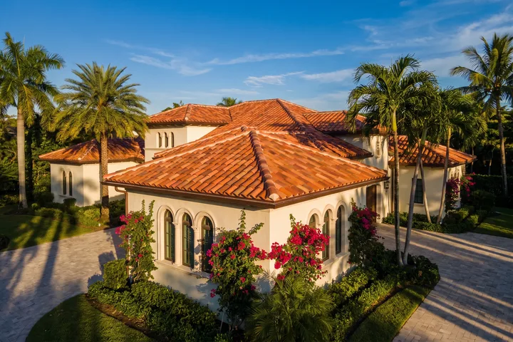 A Mediterranean-style home with a terracotta barrel tile roof.