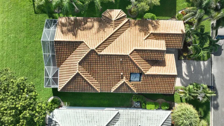Overhead view of a tile roof with intersecting hips and valleys from Perkins’ approved roofing photography.