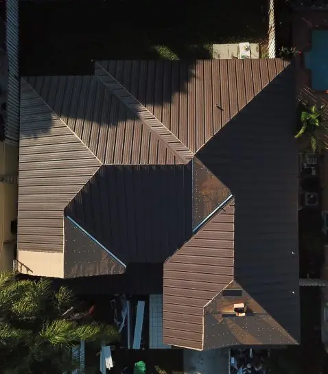 Standing-seam metal roof documented by Perkins Roofing.