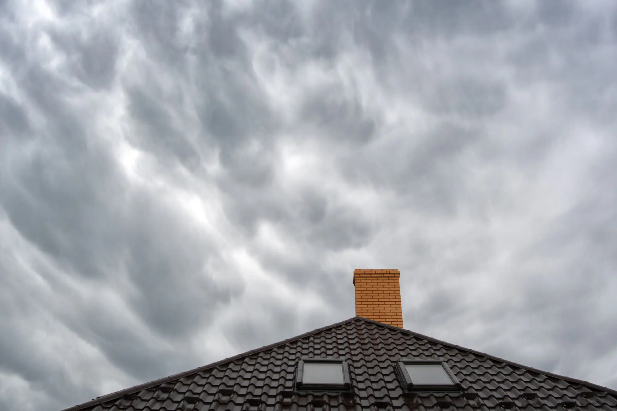 detached house What Happens If It Rains While Installing a New Roof? - roof inspection miami