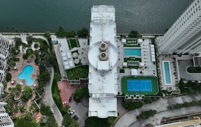 Miami-Dade HVHZ Compliance for Commercial Roofing 4 Aerial view of a commercial roof on a waterfront property in Miami-Dade